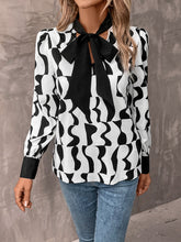 Load image into Gallery viewer, Allover Print Tie Neck Bishop Sleeve Blouse
